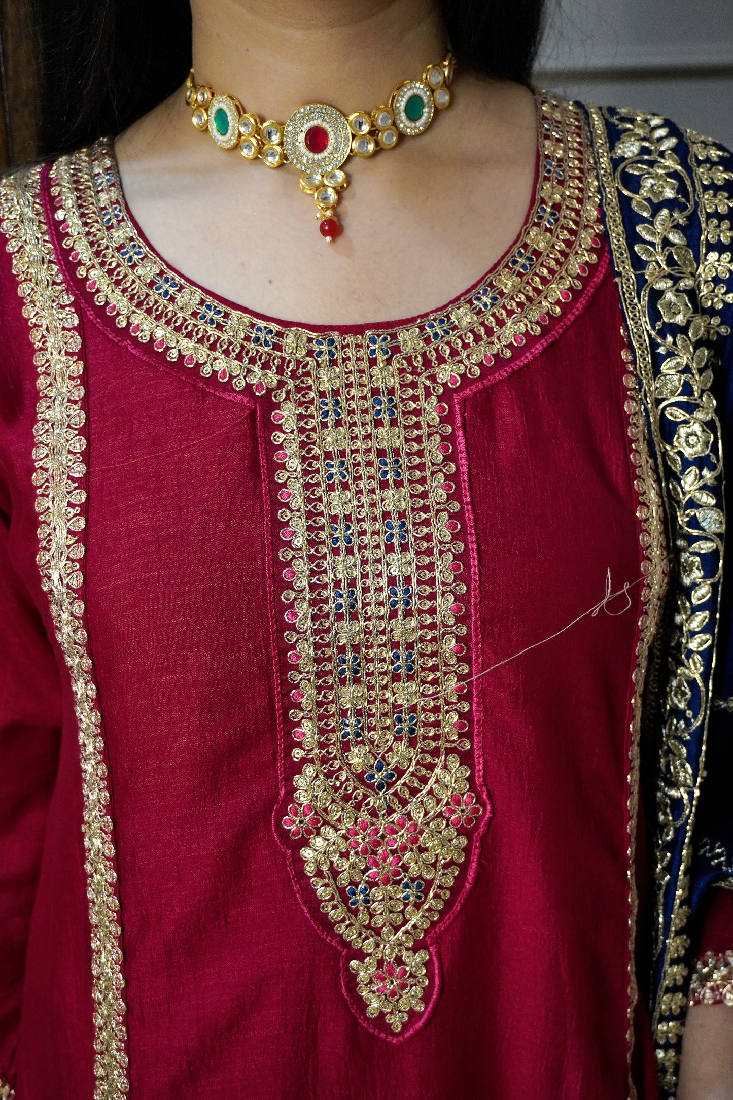 Women roes red zari detail Anarkali kurta with pant & teal colour zari dupatta